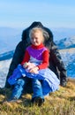 Family on autumn mountain plateau. Royalty Free Stock Photo