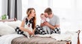 Family with dog in the bed Royalty Free Stock Photo