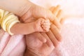 Family Baby Hands. Father and Mother Holding Newborn Kid Royalty Free Stock Photo