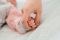 Family Baby Hands. Father and Mother Holding Newborn Kid. Child Hand Closeup into Parents Royalty Free Stock Photo