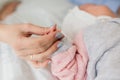 Family Baby Hands. Father and Mother Holding Newborn Kid. Child Hand Closeup into Parents Royalty Free Stock Photo