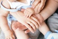 Family Baby Hands. Father and Mother Holding Newborn Kid. Child Hand Closeup into Parents Royalty Free Stock Photo