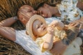 Family with baby lying and resting among wheat field Royalty Free Stock Photo