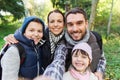 Family with backpacks taking selfie and hiking Royalty Free Stock Photo