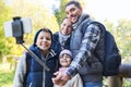 Family with backpacks taking selfie and hiking Royalty Free Stock Photo