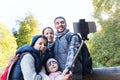 Family with backpacks taking selfie and hiking Royalty Free Stock Photo