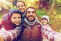 Family with backpacks taking selfie and hiking Royalty Free Stock Photo