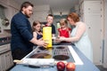 Family baking apple pie Royalty Free Stock Photo