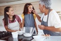 Family baking, flour fun and grandmother teaching children to bake cake in the kitchen of their home. Happy girl, mom Royalty Free Stock Photo