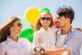 Family with balloons outdoors Royalty Free Stock Photo