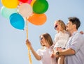 Family with balloons outdoors Royalty Free Stock Photo