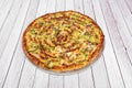 Family barbecue pizza with sauce, sliced green peppers, minced meat and lots of mozzarella cheese Royalty Free Stock Photo