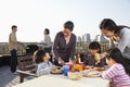 Family barbeque party, sitting at the table