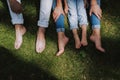 Family with bare feet resting on the grass Royalty Free Stock Photo