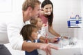 Family In Bathroom Brushing Teeth Royalty Free Stock Photo