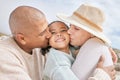 Family beach, child travel and kiss with parents happy on holiday by the tropical weather on Island in Costa Rica during Royalty Free Stock Photo