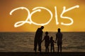Family on beach enjoy new year 2015 Royalty Free Stock Photo