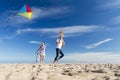 Family on the Beach Flting a Kite Royalty Free Stock Photo