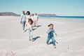 Family, beach and happy kids running in sand, playful and having fun while bonding outdoors. Face, children and parents Royalty Free Stock Photo