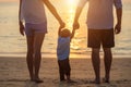 Family on the beach, Mother holding hand of her son and walking, playing on the beach with her husband Royalty Free Stock Photo