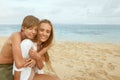 Family On Beach. Mother With Kids Enjoying Summer Vacation At Coast. Handsome Son Hugs Young Woman. Family Weekend. Royalty Free Stock Photo