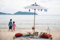 Family beach picnic at Phuket sea shore hotel