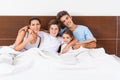 Family on bed bedroom, couple parents children