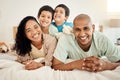 Family, bed and portrait of parents and kids bonding in a bedroom in a house and playing together. Smile, mother and Royalty Free Stock Photo