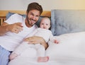 Family, bedroom and portrait of father with baby for bonding, relationship and love for parenting. Happy, home and dad Royalty Free Stock Photo