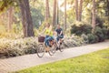 Family on bicycles in park- Boy on bike with mother and father Royalty Free Stock Photo