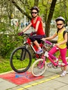 Family bike ride. Family wearing bicycle helmet with rucksack . Royalty Free Stock Photo