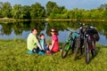 Family bike ride outdoors, active parents and kid cycling Royalty Free Stock Photo