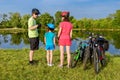 Family bike ride outdoors, active parents and kid cycling Royalty Free Stock Photo