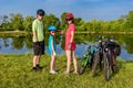 Family bike ride outdoors, active parents and kid cycling Royalty Free Stock Photo