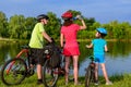 Family bike ride outdoors, active parents and kid cycling Royalty Free Stock Photo