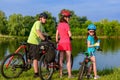 Family bike ride outdoors, active parents and kid cycling Royalty Free Stock Photo