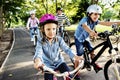 Family on a bike ride in the park