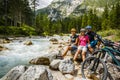 Family bike rides in the mountains while relaxing on the riverbank. Royalty Free Stock Photo