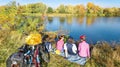 Family on bikes autumn cycling outdoors, active parents and kid on bicycles, aerial view of happy family with child relaxing Royalty Free Stock Photo