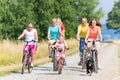 Family on bikes at dirt path