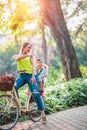 Family on bikes- mother and son riding a bicycle together outdoors Royalty Free Stock Photo