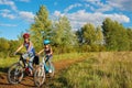 Family on bikes outdoors, active mother and kid cycling, fitness and healthy lifestyle