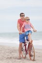 Family biking at the beach Royalty Free Stock Photo