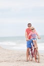 Family biking at the beach Royalty Free Stock Photo