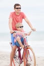 Family biking at the beach Royalty Free Stock Photo