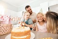 Family birthday party, smile in home kitchen, happy mother kiss girl child, children love fun quality time together and Royalty Free Stock Photo
