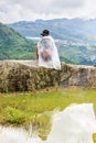 A family of the Black H'mong Ethnic Minority People sit on hill in Sapa, Vietnam on September 14, 2016 Royalty Free Stock Photo