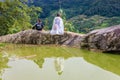 A family of the Black H'mong Ethnic Minority People sit on hill in Sapa, Vietnam on September 14, 2016 Royalty Free Stock Photo