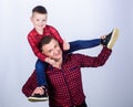 Family bonding. childhood. parenting. happy family. father and son in red checkered shirt. fathers day. little boy with Royalty Free Stock Photo