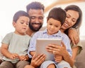 Family bonding, children and tablet kid game of parents and kids together on a education app. Happy people on digital Royalty Free Stock Photo